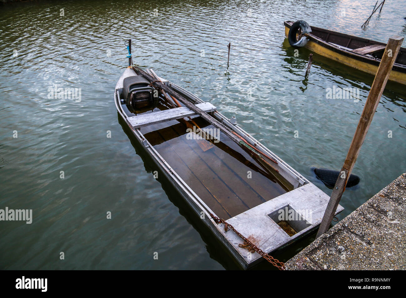 Small fishing boat on lake hi-res stock photography and images
