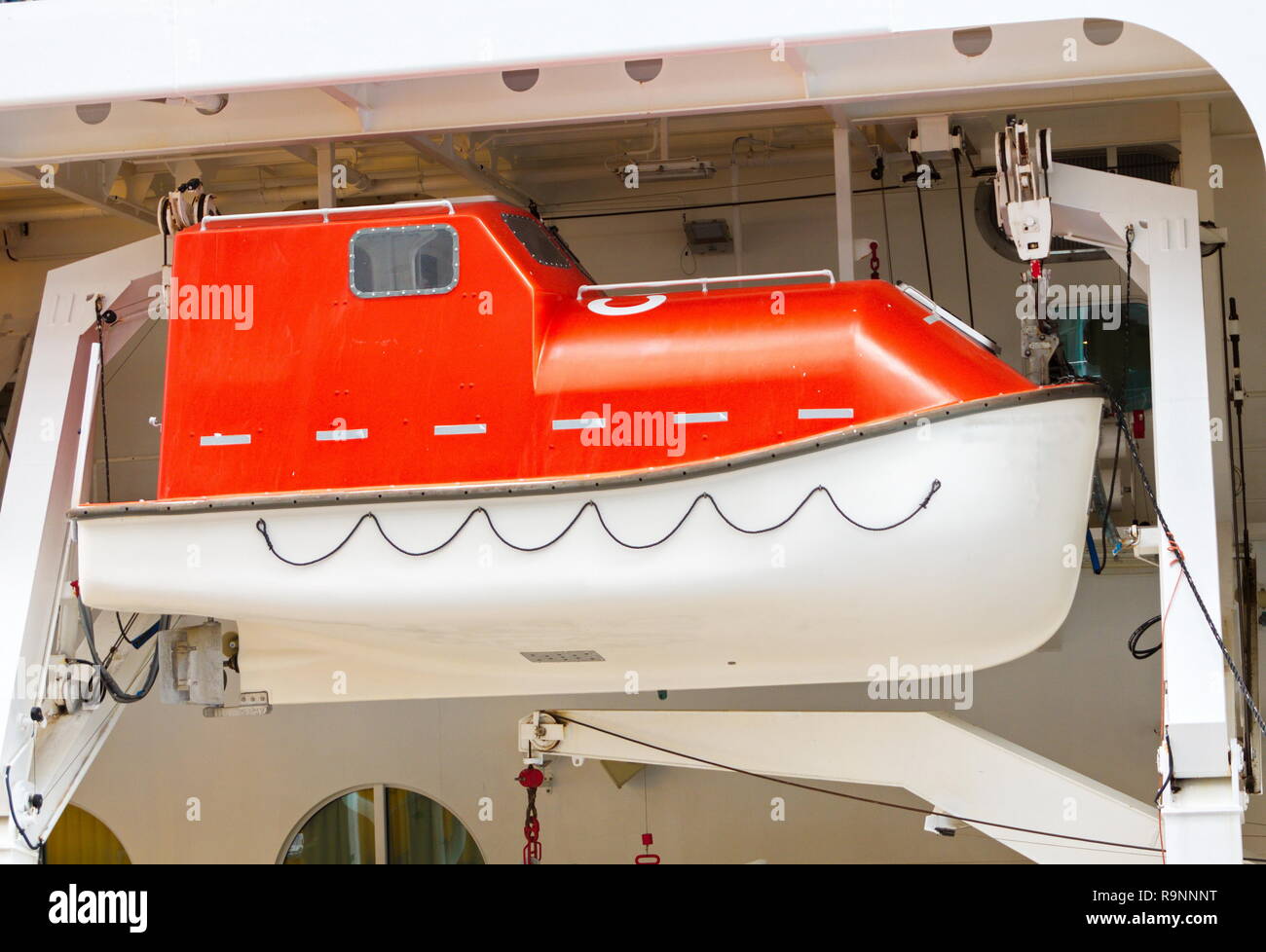 An orange and white lifeboat on a cruise ship Stock Photo Alamy