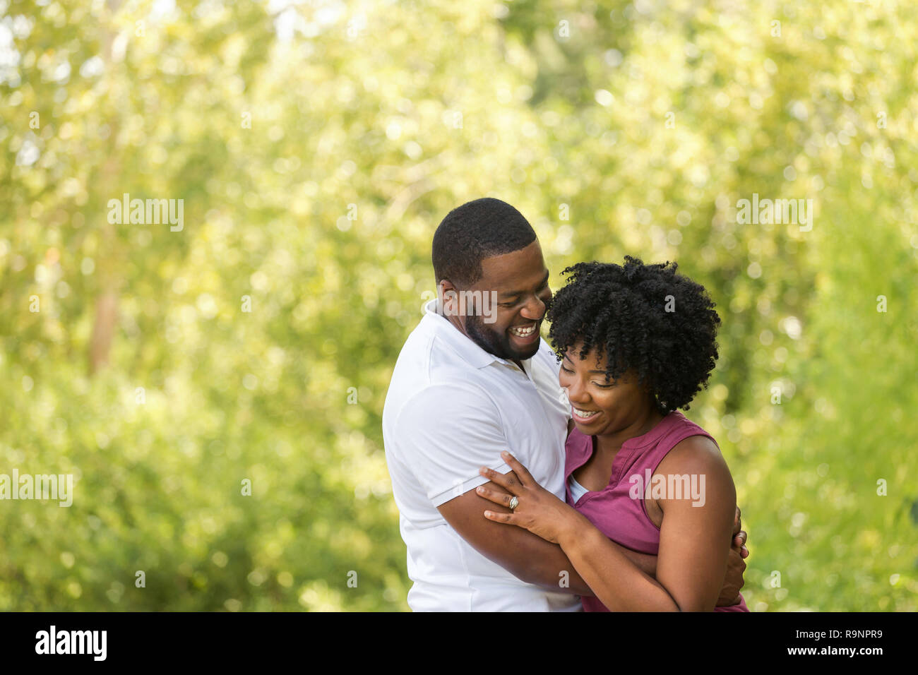 Happy African American couple laughing and smiling Stock Photo - Alamy
