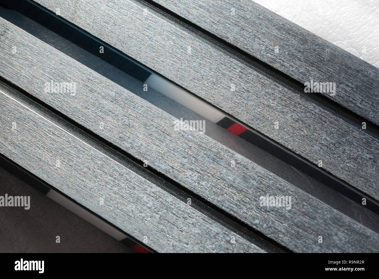Modern cross-country skis with nanotechnology grip coating on bases. Stock Photo