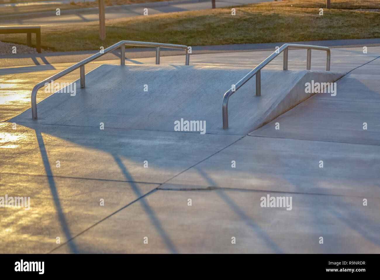 Small skate ramp with rails in neighborhood Stock Photo Alamy