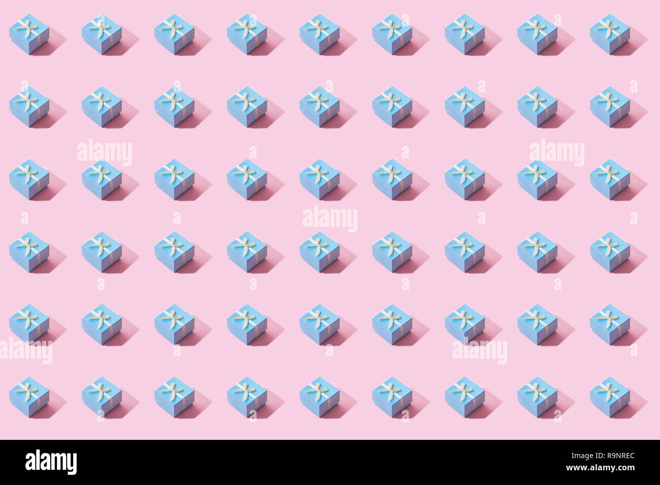 Blue Gift Box Pattern. Pink background. Stock Photo
