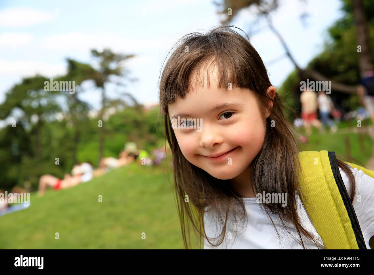 Portrait of little girl smiling in the park Stock Photo - Alamy