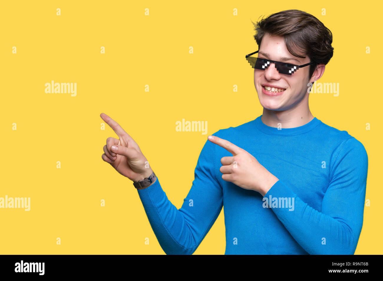 Young man wearing funny thug life glasses over isolated background smiling and looking at the camera pointing with two hands and fingers to the side Stock Photo - Alamy Young man wearing funny thug life glasses over isolated background smiling and looking at the camera pointing with two hands and fingers to the side Stock Photo - Alamy