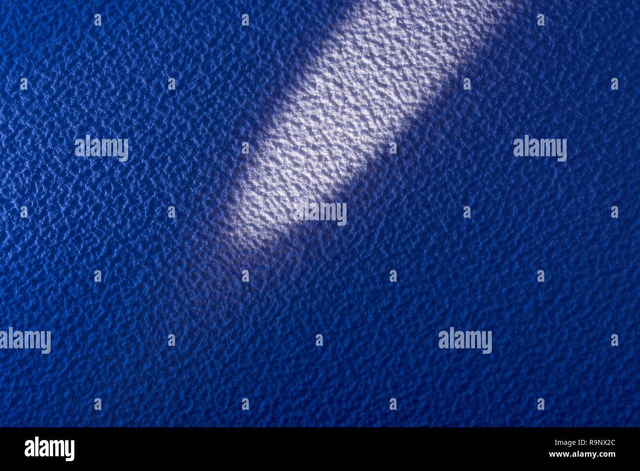 Rough surface of polystyrene ceiling tiles. Metaphor rough surface, abstract texture, rough texture, bumpy, insulation foam. Bumpy surface texture. Stock Photo