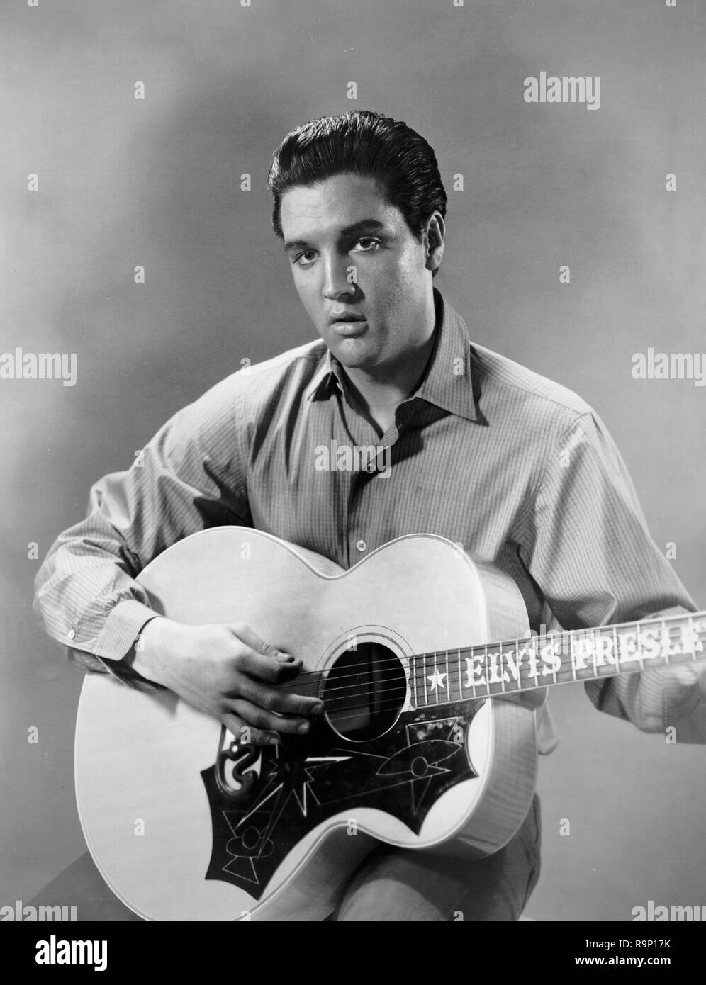 Elvis Presley,  with his guitar, circa 1962  File Reference # 33635 704THA Stock Photo