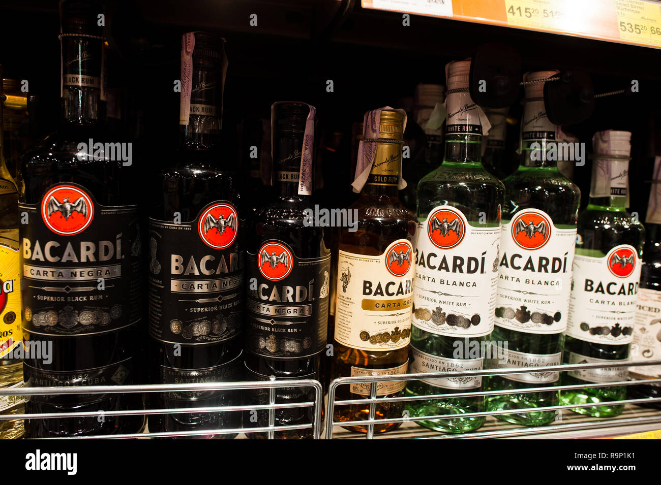 Kyiv, Ukraine - December 19, 2018: Bottles of Bacardi on shelves in a supermarket. Bacardi Limited is the largest privately held, family-owned spirits Stock Photo