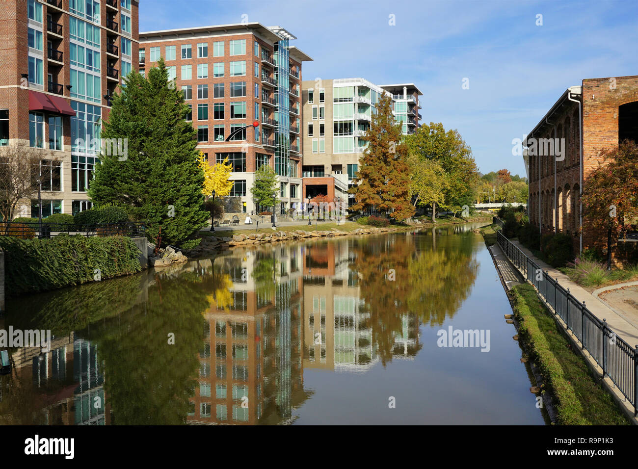Greenville cityscape - buildings reflecting in Reedy River Stock Photo