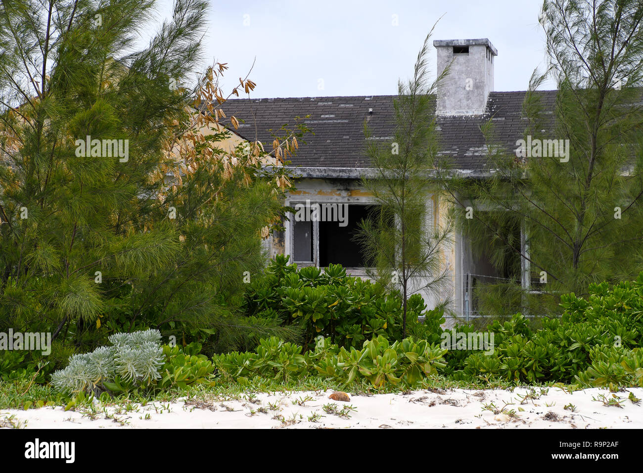 exterior of vacant run down residential house in the Bahamas Stock Photo