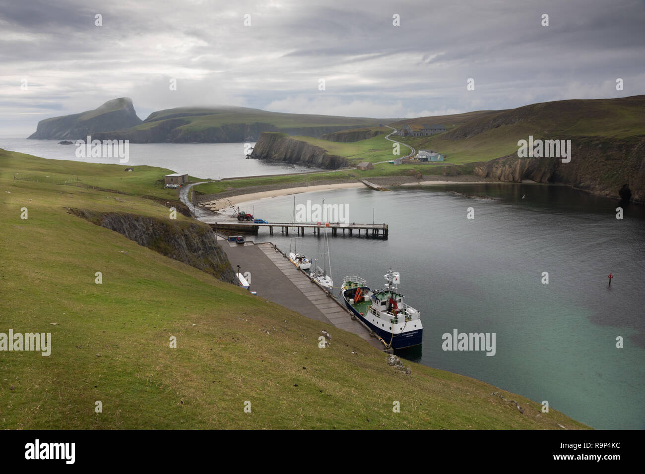 North harbour on Fair Isle with sheep rock in backround Stock Photo