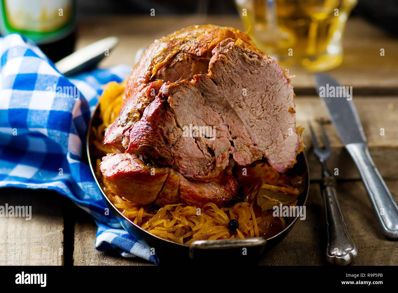 the baked pork gammon with sauerkraut and beer Stock Photo Alamy