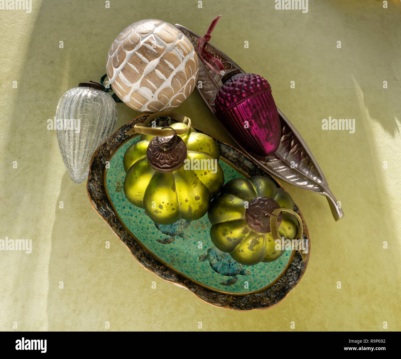 Various Christmas decorations against a green background. Stock Photo