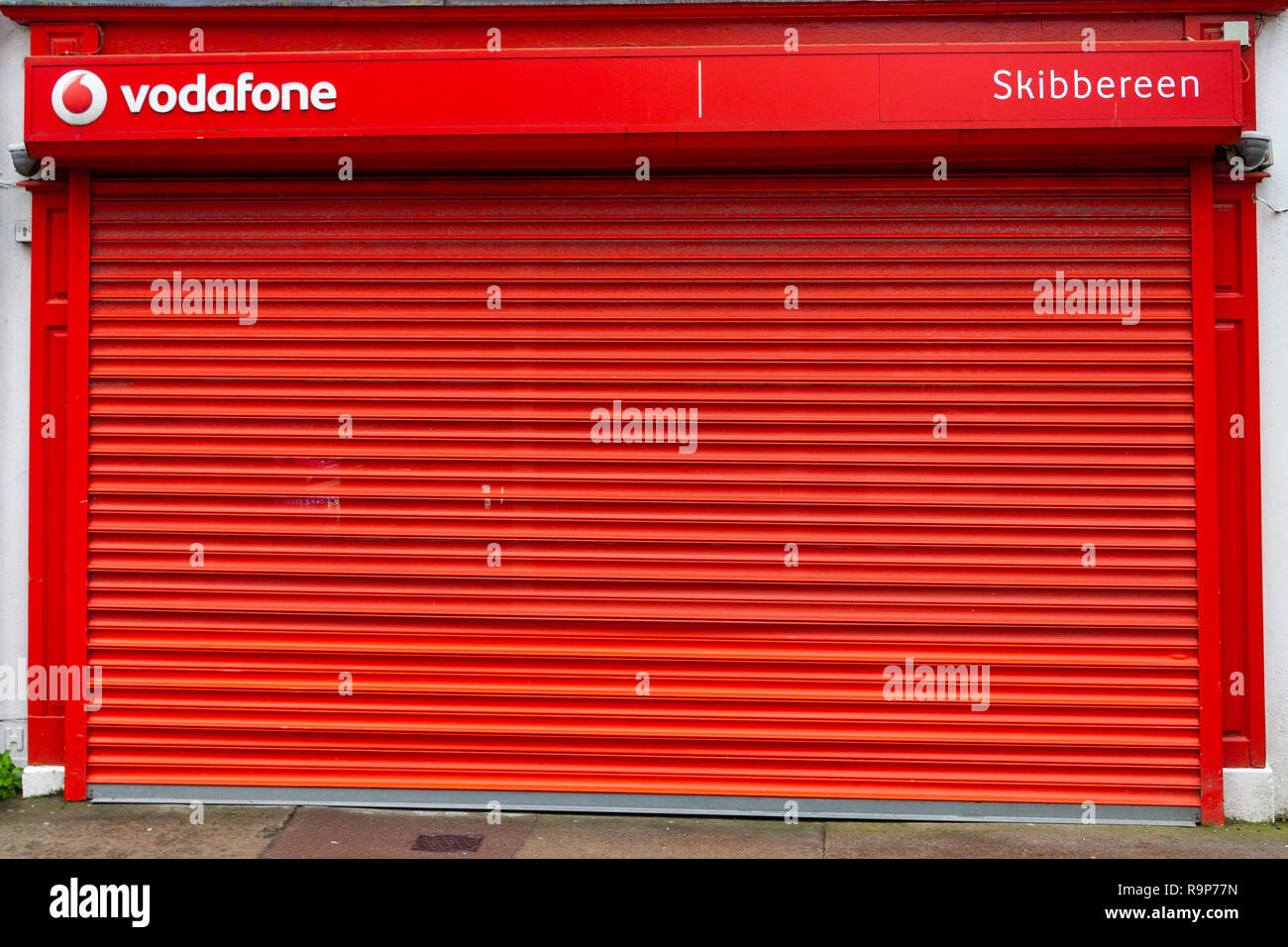Vodafone shop shut with metal shutters down Stock Photo
