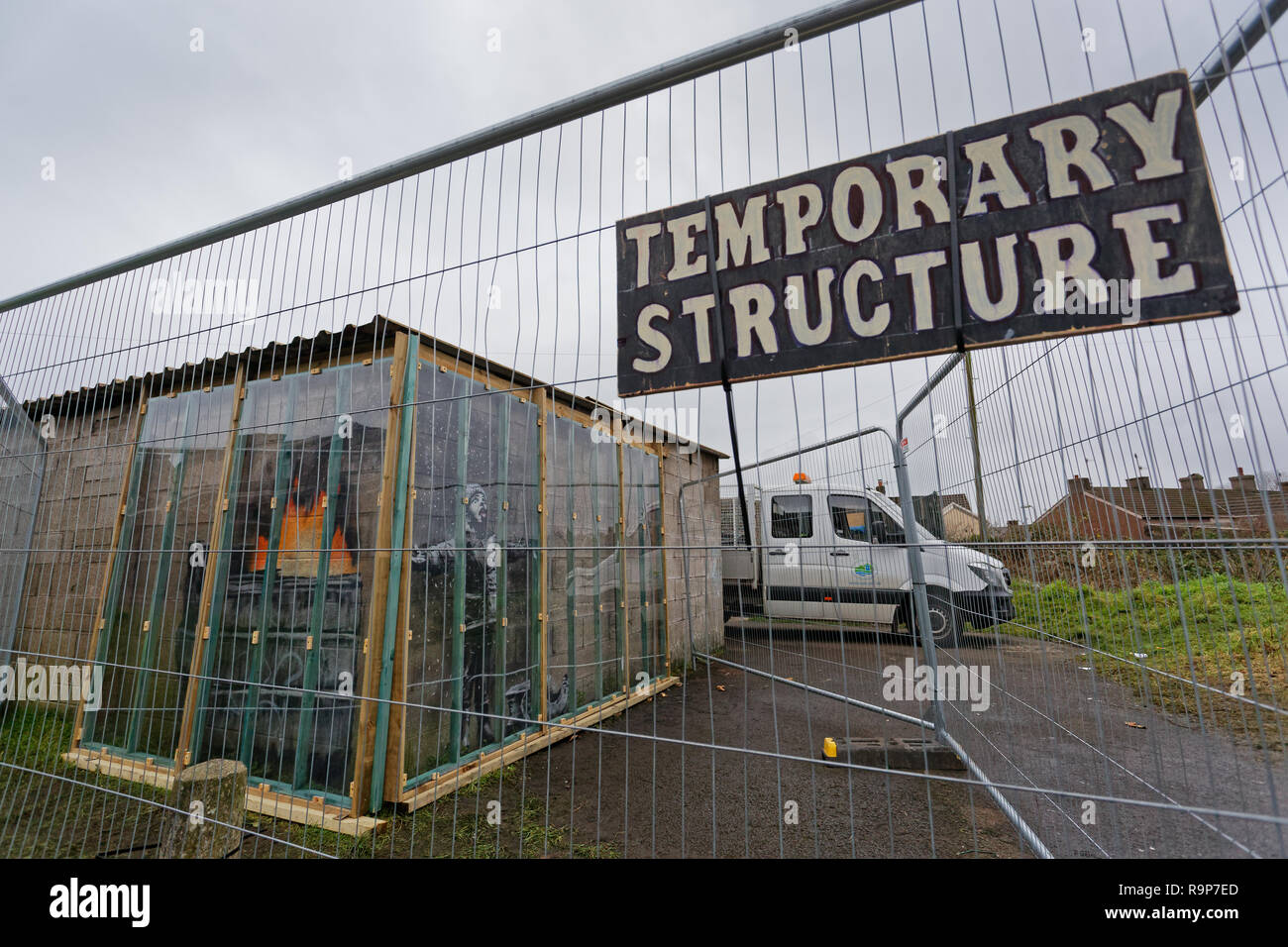 Pictured A Temporary Structure Sign On The Fence Protecting The