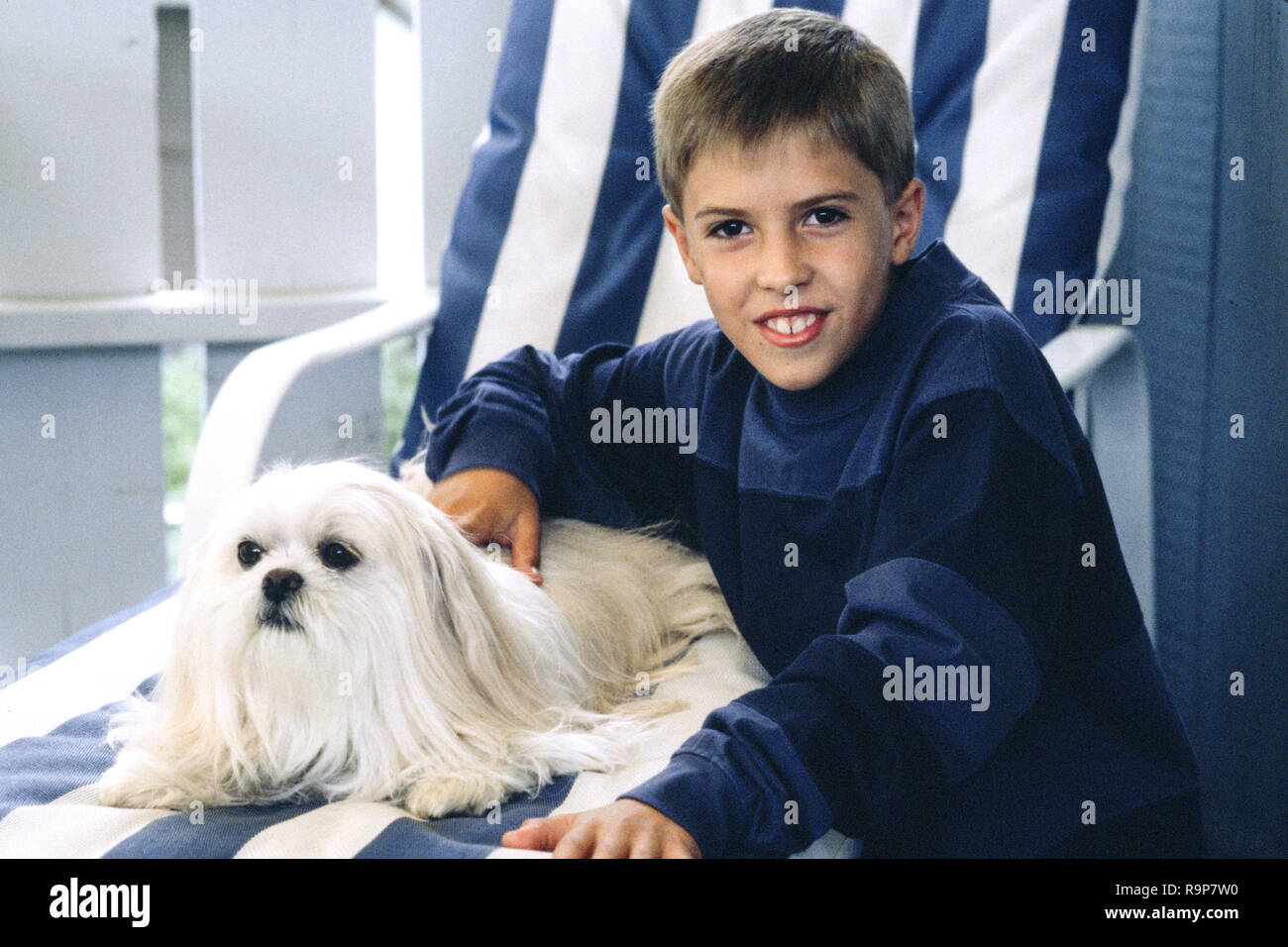 Nine Year Old Boy with His Pet Dog, USA Stock Photo
