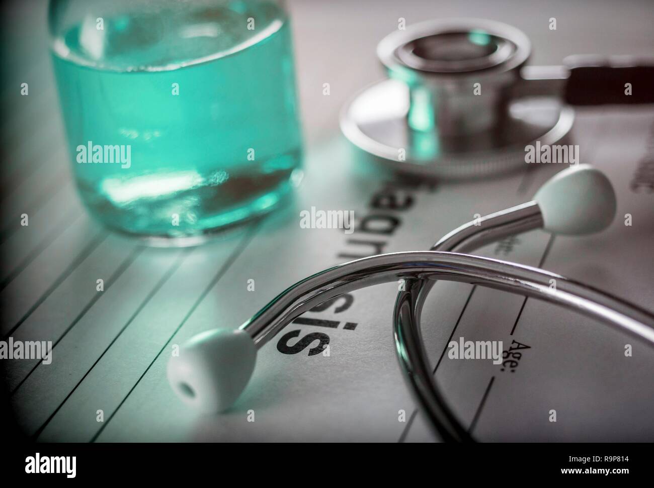 Vial of medication along with a stethoscope, conceptual image Stock Photo