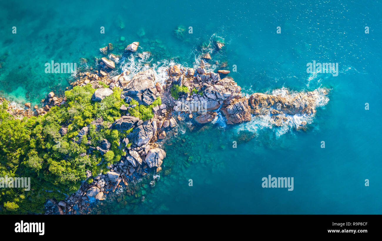 Tropical island with sea and palm taken from drone. Seychelles aerial photo. St Pierre Island Stock Photo