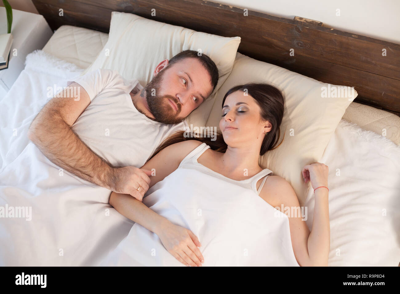 husband and wife in bed in the morning woke up Stock Photo