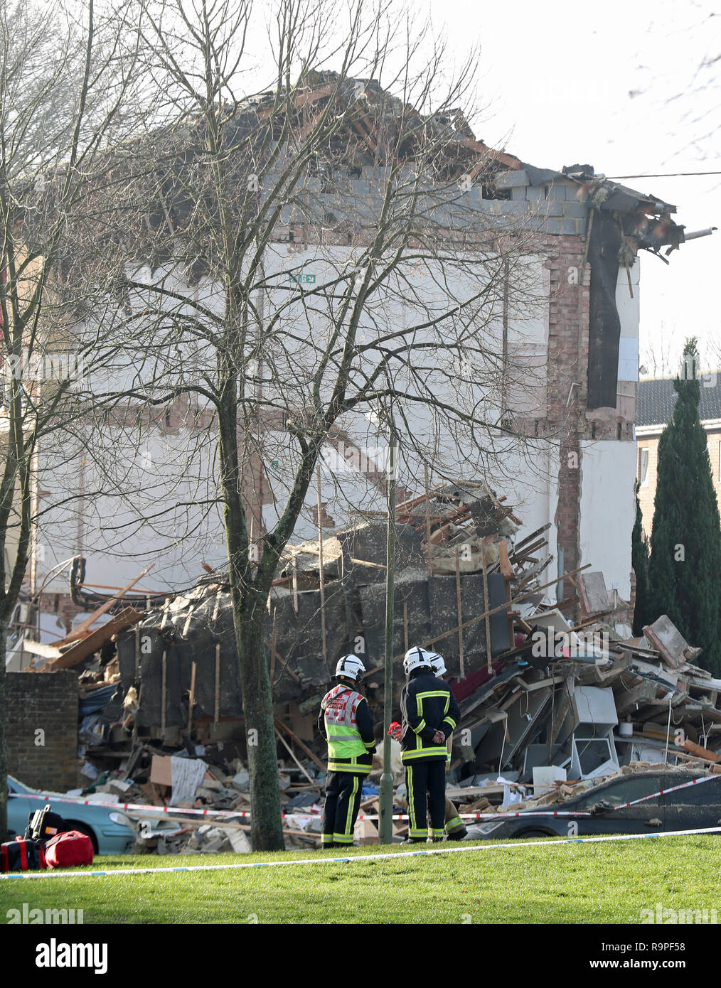 Emergency service personnel in Launcelot Close, Andover, where Hampshire Police say that the body of a man has been found after an explosion caused a building to collapse this morning. Stock Photo