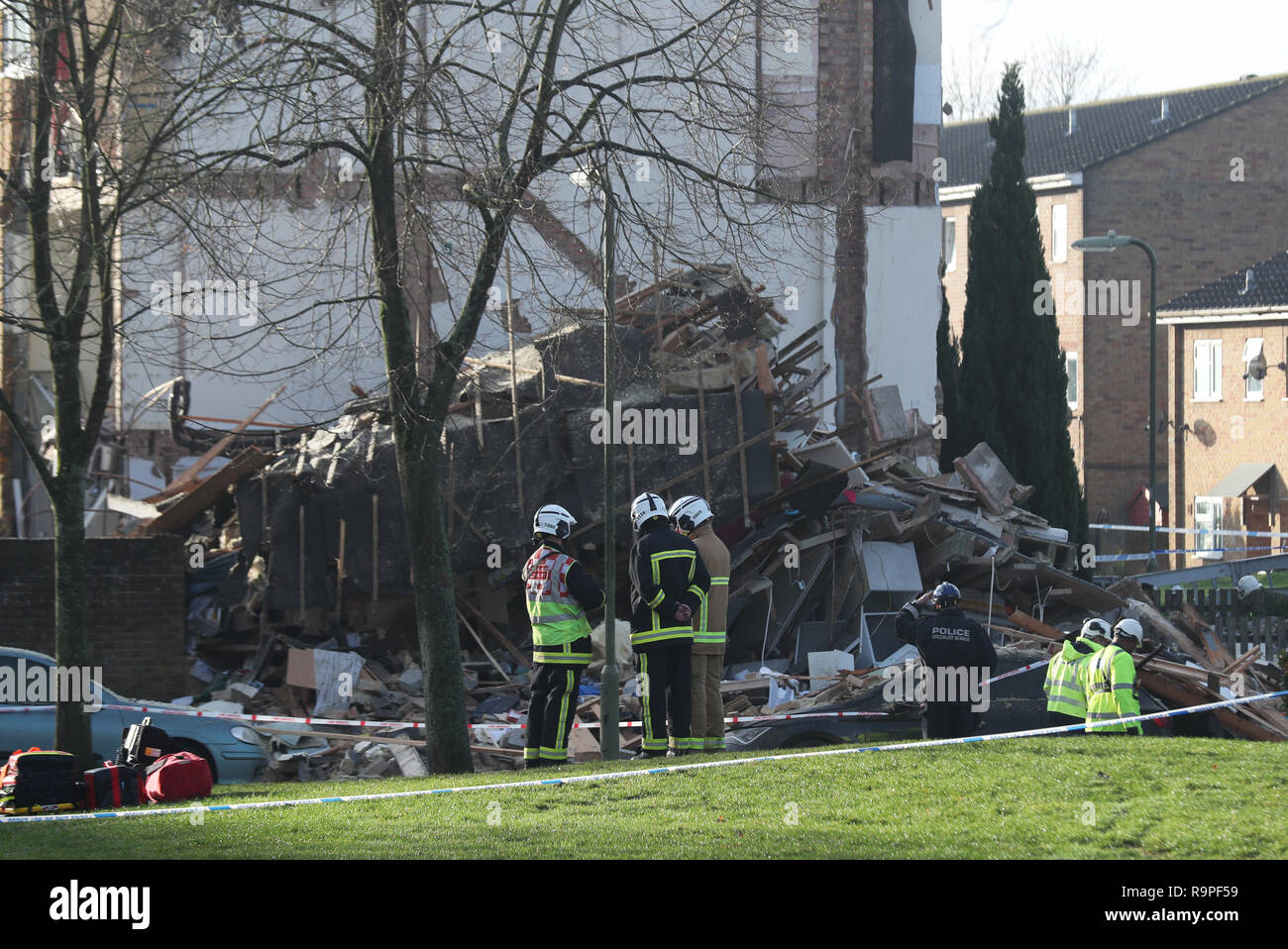 Emergency service personnel in Launcelot Close, Andover, where Hampshire Police say that the body of a man has been found after an explosion caused a building to collapse this morning. Stock Photo