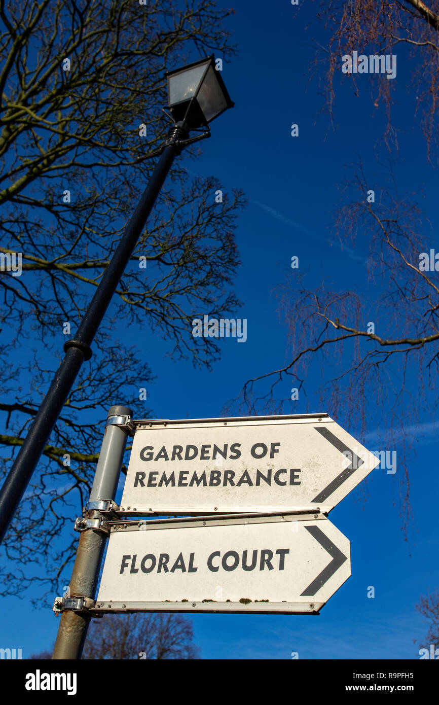 Close up of Floral court and Gardens of remembrance signs in cemetery UK Stock Photo