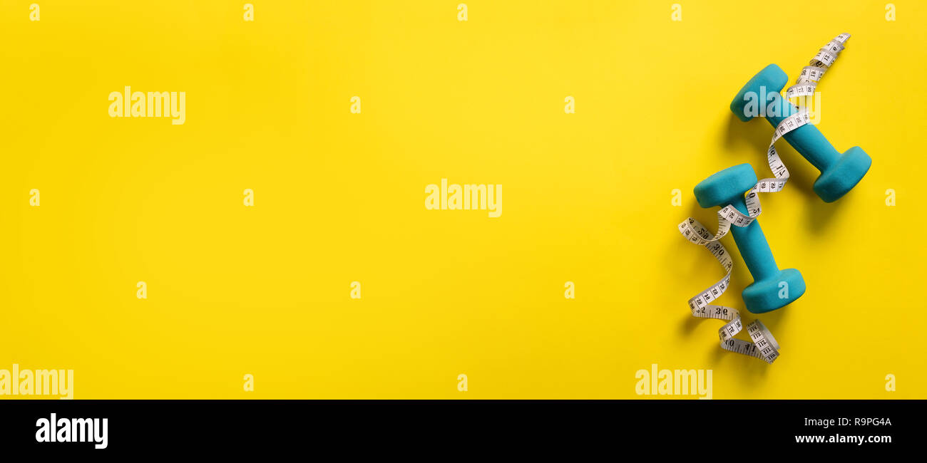 Download Fitness Sport Concept With Dumbbells And Measuring Tape Over Yellow Background Banner Copy Space Top View Flat Lay Stock Photo Alamy Yellowimages Mockups