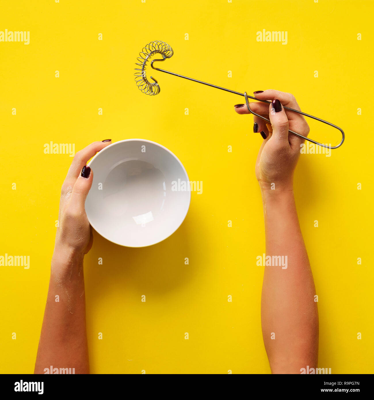 Female hands holding cooking equipment for meringue, sponge cake