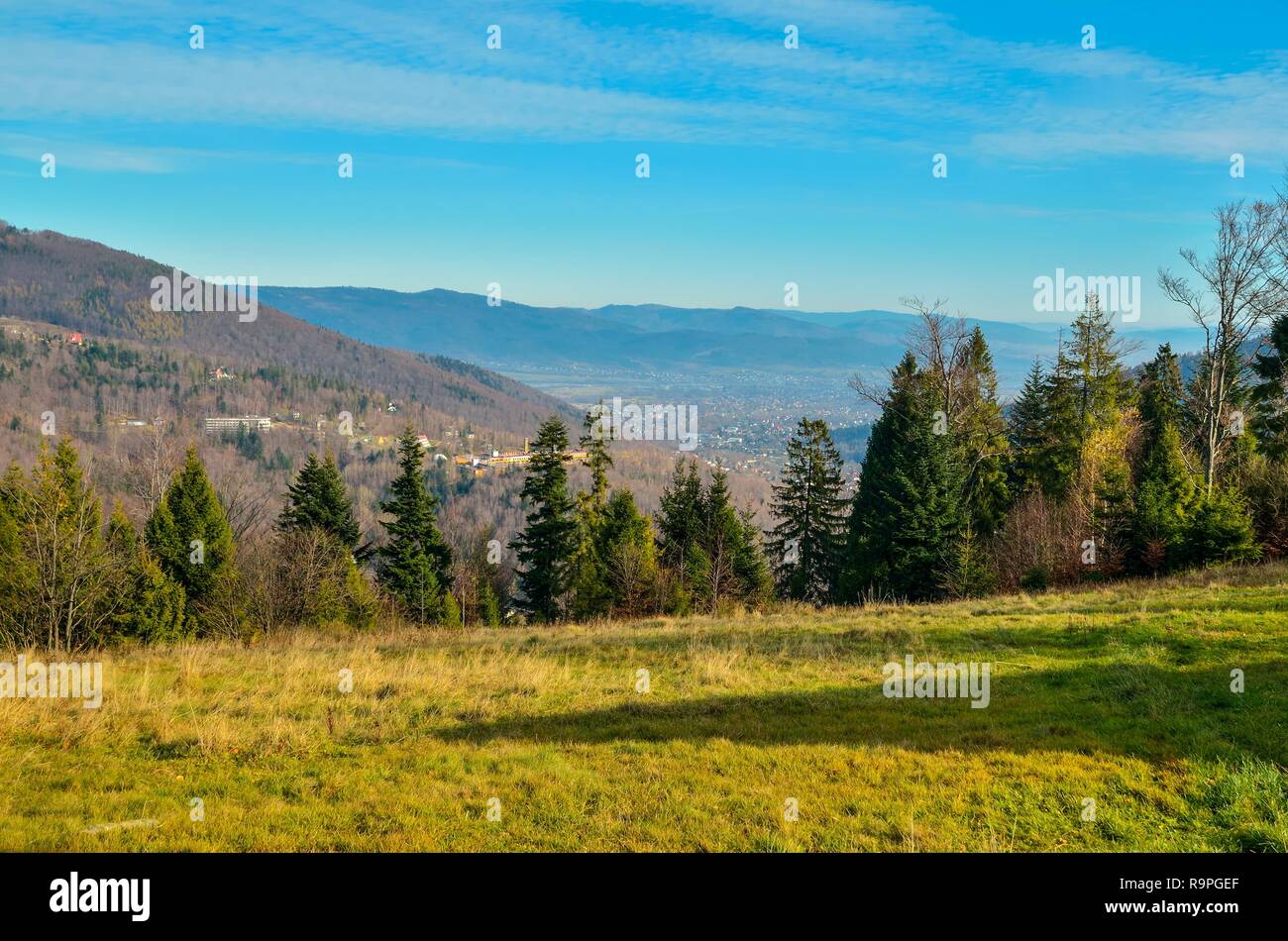 Beautiful autumnal mountain landscape. View of the valley and green hills. Stock Photo
