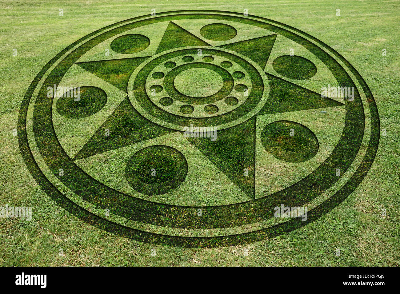 Concentric circles and star fake crop circle in the meadow Stock Photo