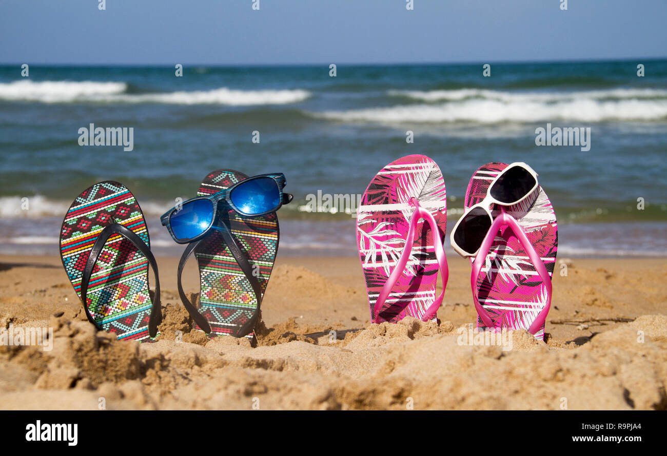 flip flops with sunglasses on the beach Stock Photo - Alamy