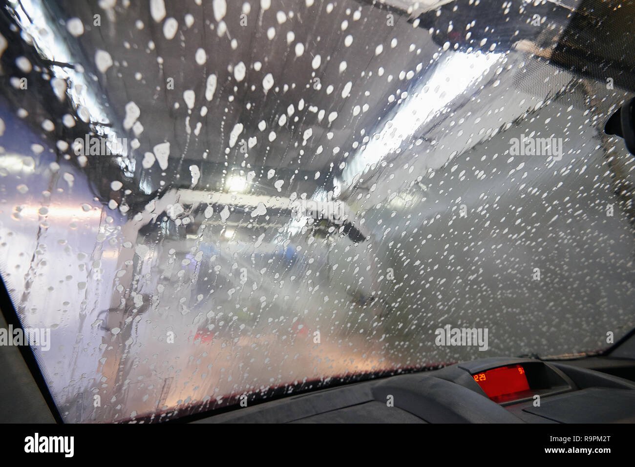 Automatic carwash tunnel station view from inside car Stock Photo