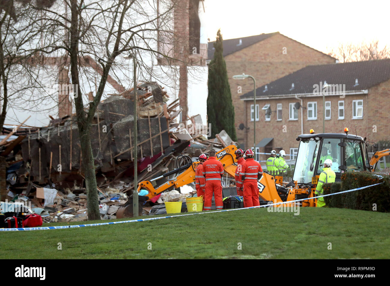 Gas engineers and an urban search and rescue team at the scene in Launcelot Close, Andover, where Hampshire Police say that the body of a man has been found after an explosion caused a building to collapse this morning. Stock Photo