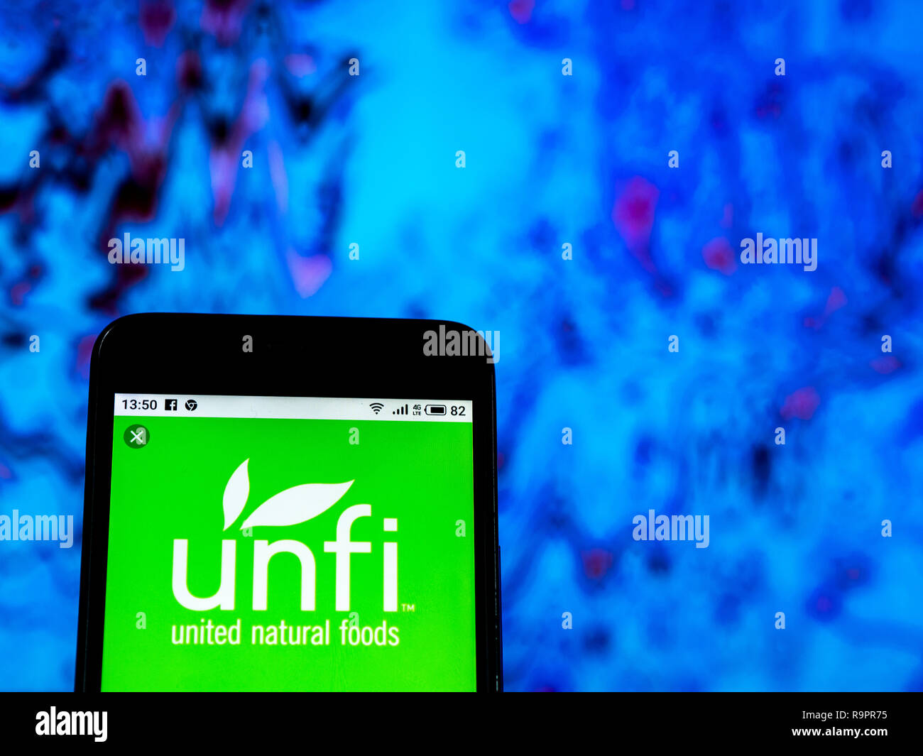United Natural Foods Grocery store company logo seen displayed on smart