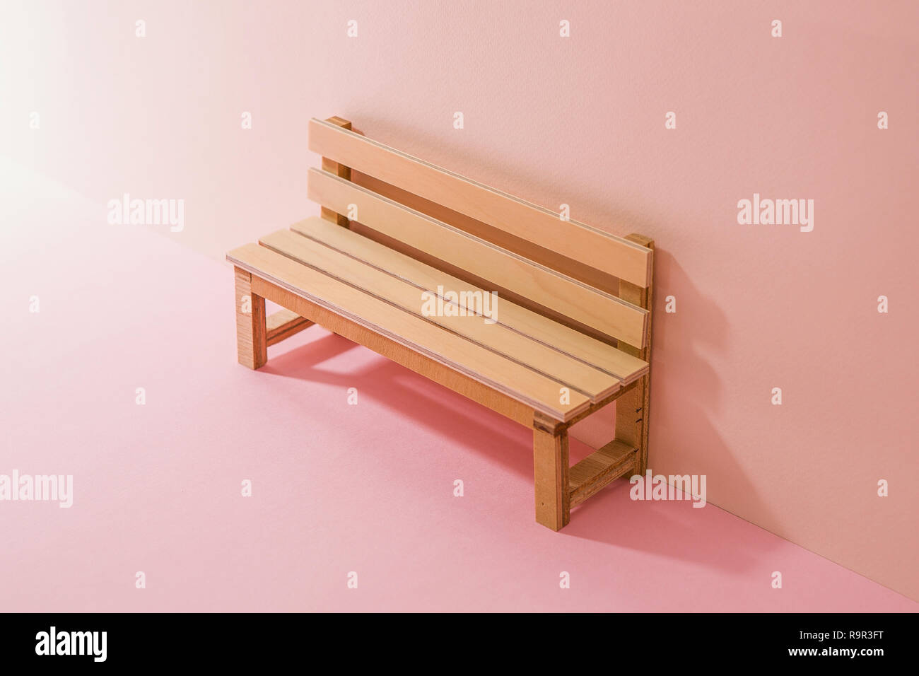 a wooden bench miniature. Pink Two Tone Background Stock Photo Alamy