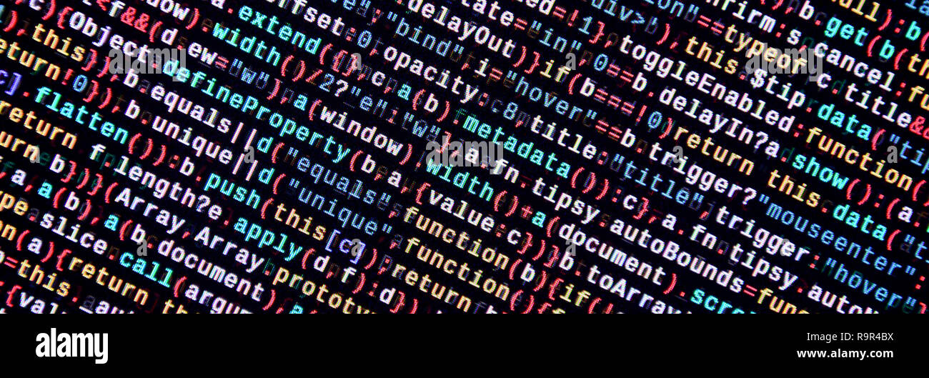 Writing programming code on laptop. Digital binary data on computer ...