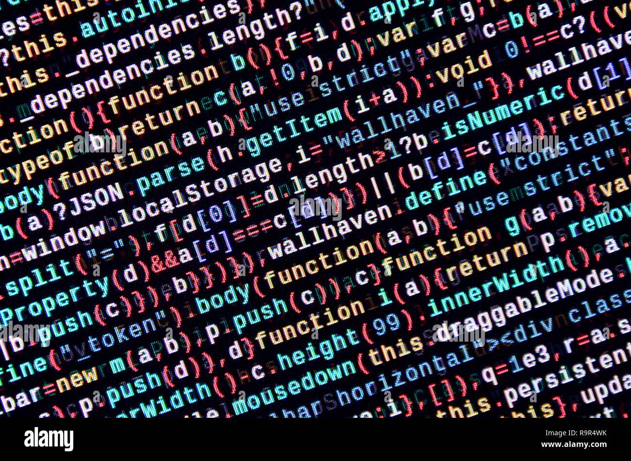 Writing programming code on laptop. Digital binary data on computer ...