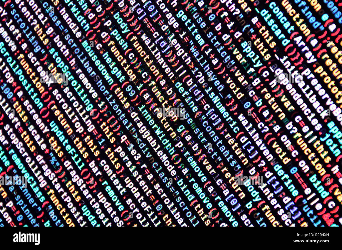 Writing programming code on laptop. Digital binary data on computer ...