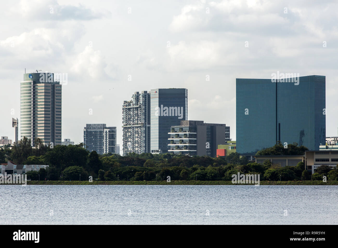 View of Jurong East from Pandan Reservoir. Consists of commercial buildings such as shopping malls, hospital, hotel and residential, Singapore. Stock Photo