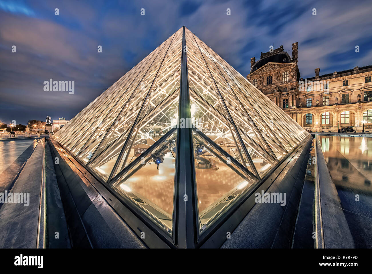 Le Louvre museum in evening Stock Photo