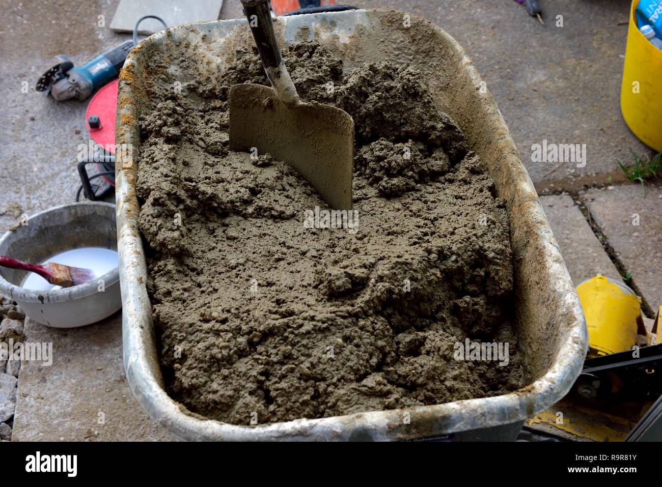 Cement wheelbarrow hires stock photography and images Alamy