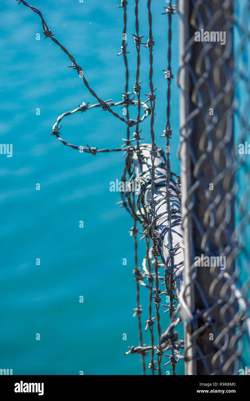 barbed wire fence for protection at Lake Coleridge, New Zealand Stock
