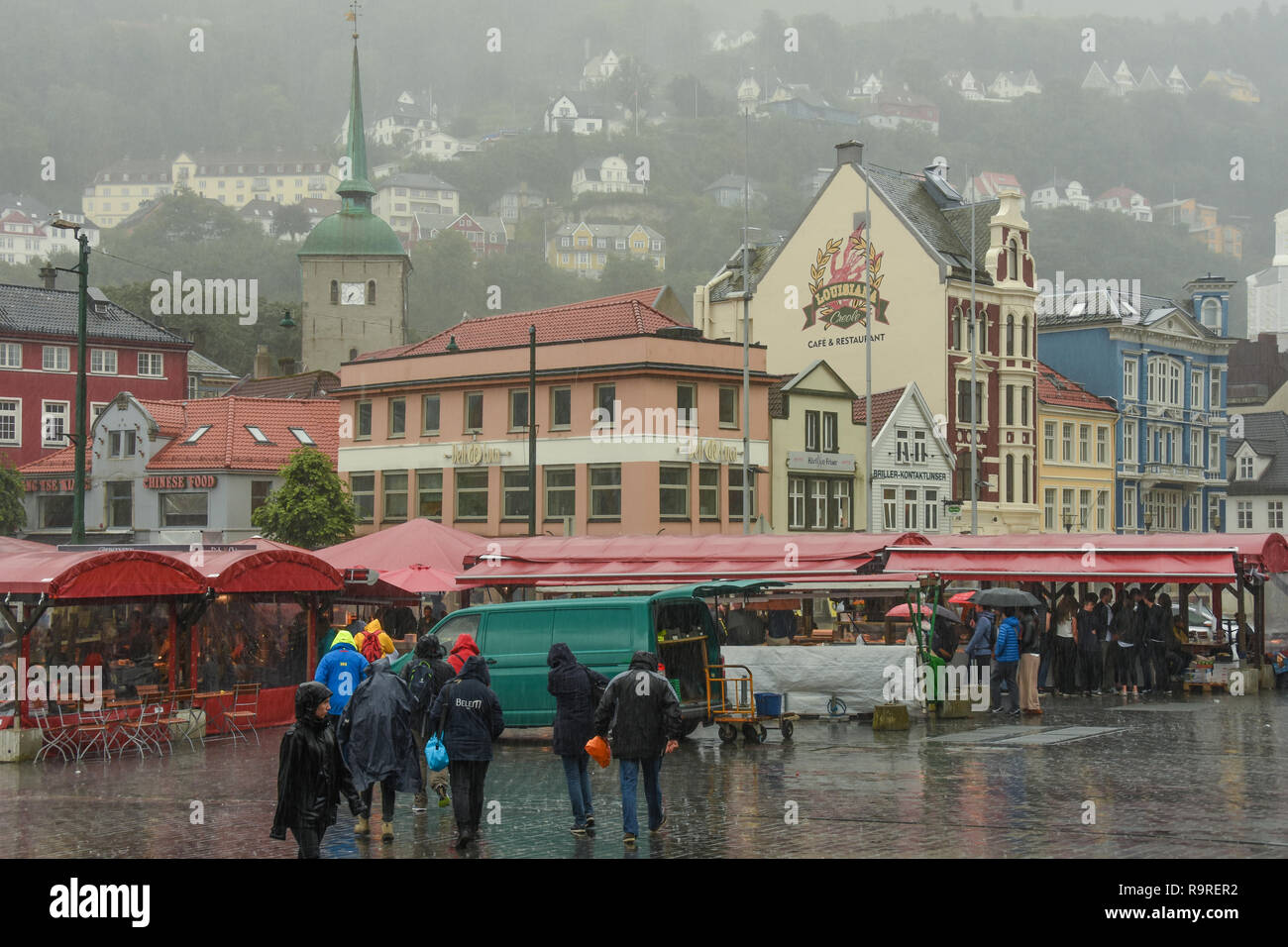 People in a rain storm, Bergen, Norway Stock Photo - Alamy
