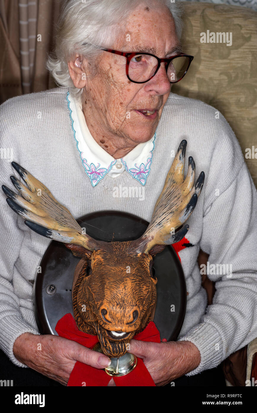Elderly woman holding her rubber mousses head Stock Photo