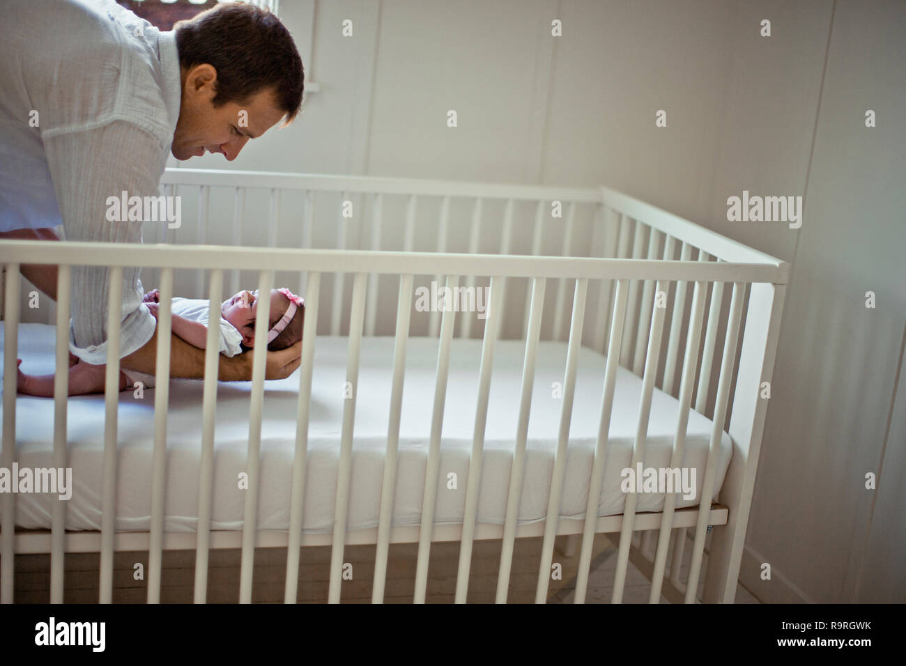 Father Baby Cot High Resolution Stock Photography and Images Alamy