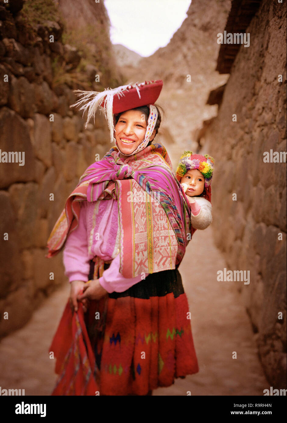 Peruvian woman in alleyway Stock Photo