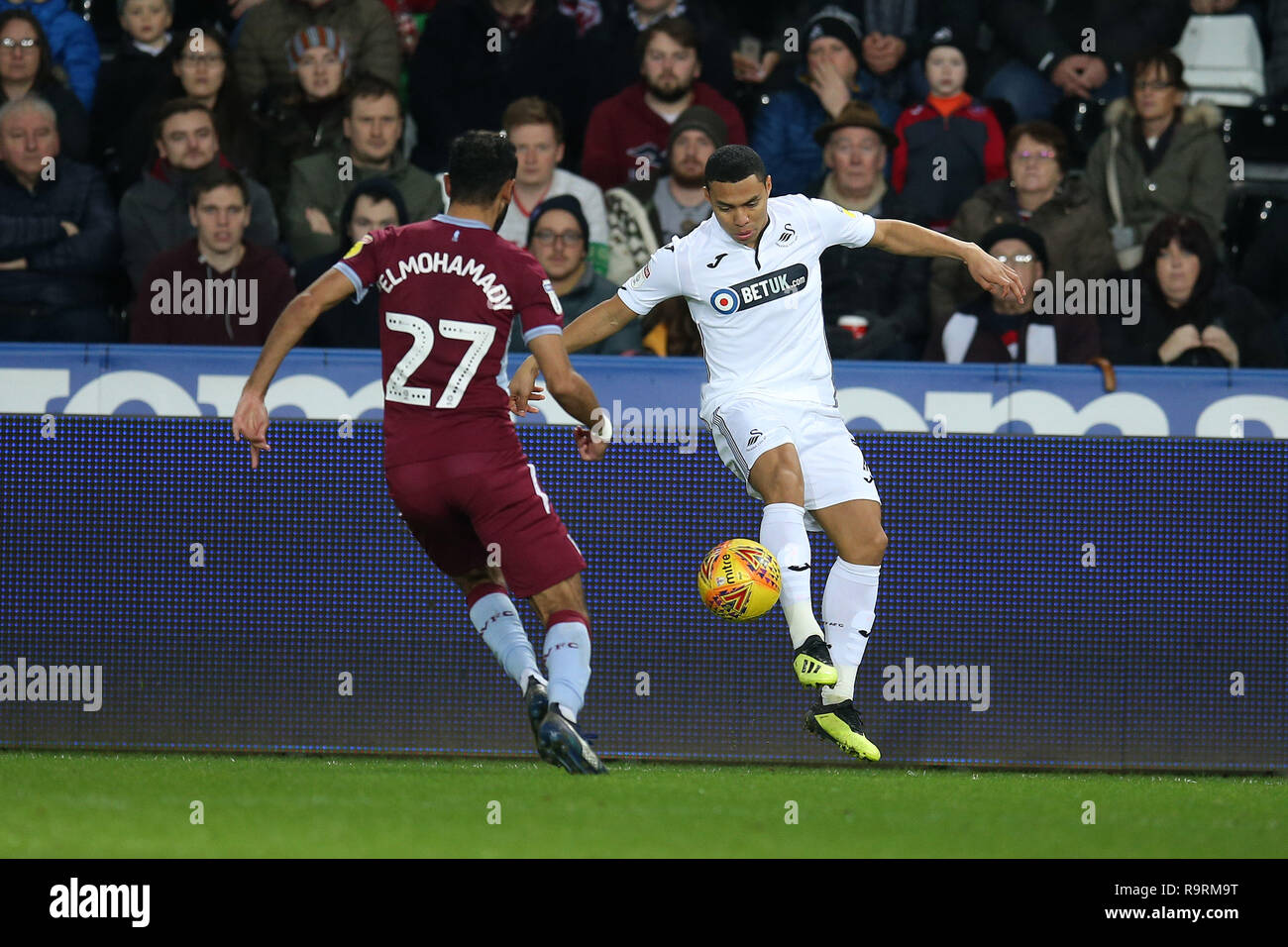 Swansea, UK. 26th Dec, 2018. Ahmed Elmohamady of Aston Villa (l) and Jefferson Montero of Swansea city in action. EFL Skybet championship match, Swansea city v Aston Villa at the Liberty Stadium in Swansea, South Wales on Boxing day, Wed 26th December 2018. this image may only be used for Editorial purposes. Editorial use only, license required for commercial use. No use in betting, games or a single club/league/player publications. pic by Andrew Orchard/Andrew Orchard sports photography/Alamy Live news Credit: Andrew Orchard sports photography/Alamy Live News Stock Photo