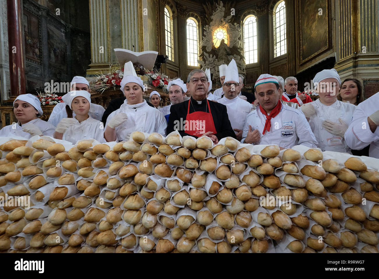 In the Cathedral of Naples, a moment of Christmas lunch for the poor served by the Cardinal of Naples Crescenzio Sepe and by the students of the Torre Annunziata hotel institute. 12/28/2018, Naples, Italy Stock Photo