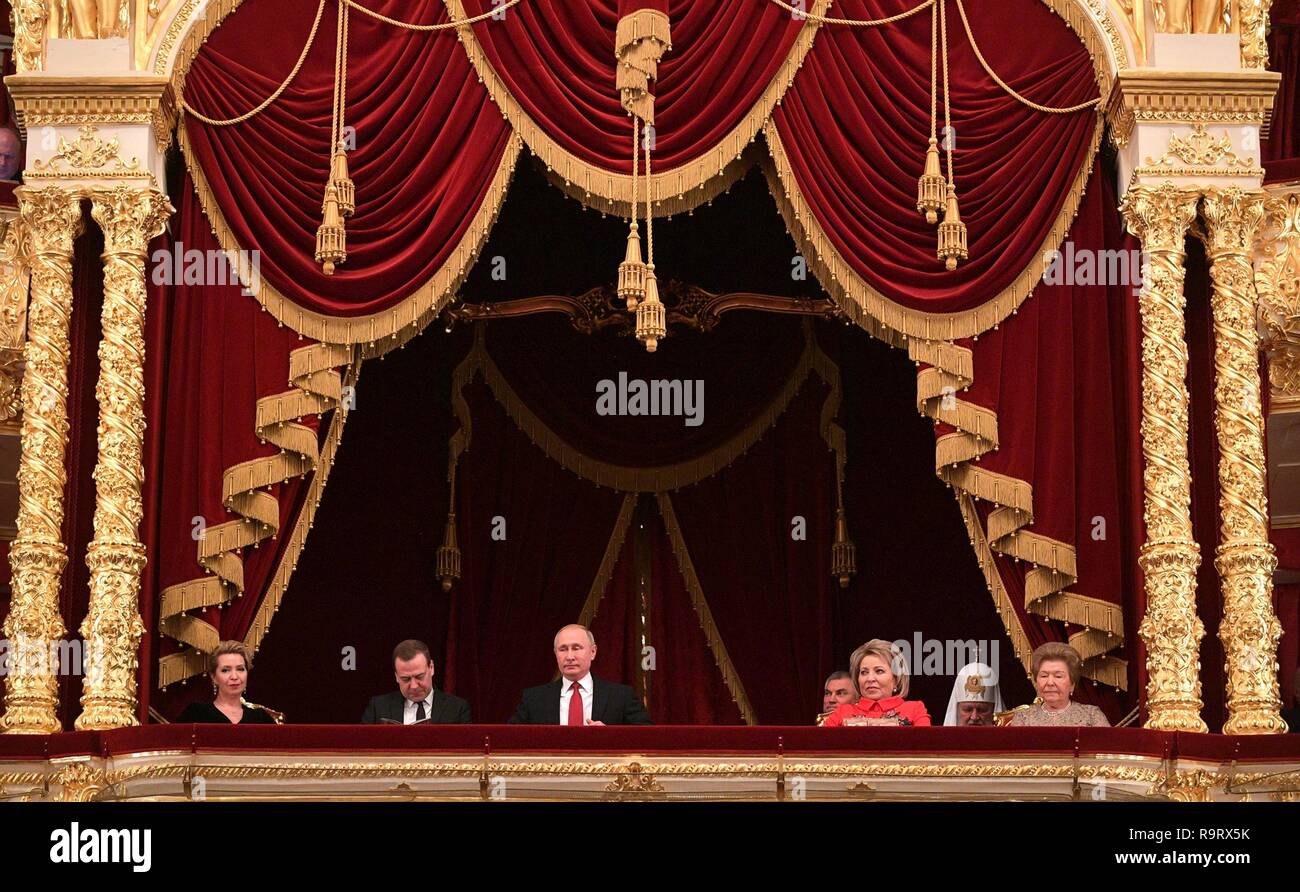 Russian President Vladimir Putin, center, sits in the presidential box during a performance of The Nutcracker during the annual New Year gala at the Bolshoi Theater December 27, 2018  in Moscow, Russia. Joining Putin from left to right: Svetlana Medvedeva, Dmitry Medvedev, Vladimir Putin, Vyacheslav Volodin, Valentina Matviyenko, Patriarch Kirill, and Naina Yeltsin. Stock Photo