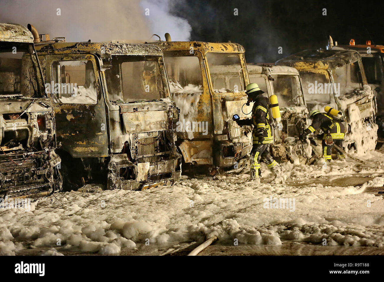 Thannhausen, Germany. 29th Dec, 2018. Firefighters are on duty after seven trucks burned down. Seven trucks burned on a company site in Thannhausen in the district of Günzburg. Credit: Ralf Zwiebler/dpa/Alamy Live News Stock Photo