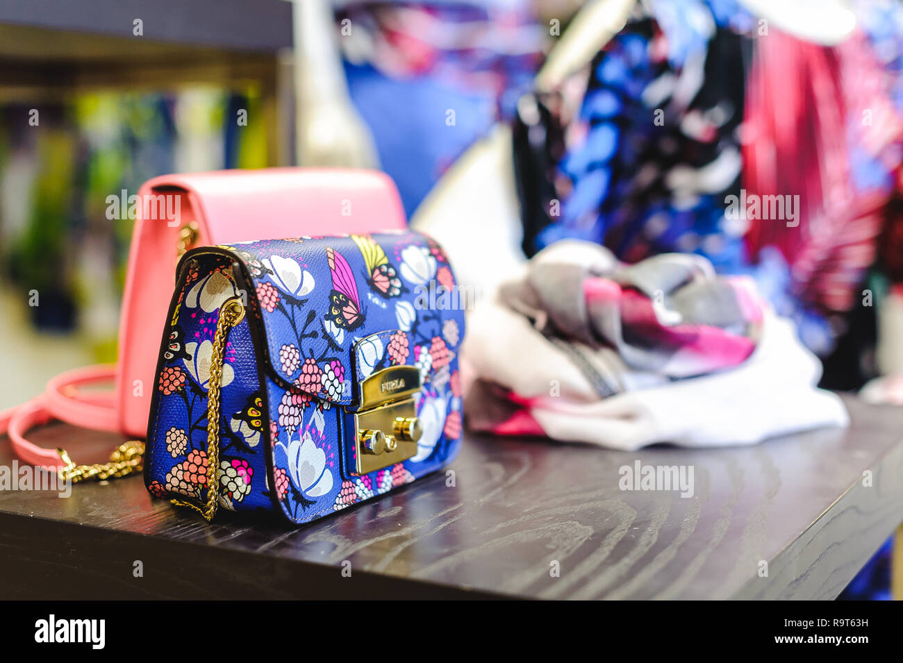 Russia, Novosibirsk - April 25, 2018: interior of women's clothing and accessories store boutique EMPORIO / FURLA handbags ladies bags Stock Photo